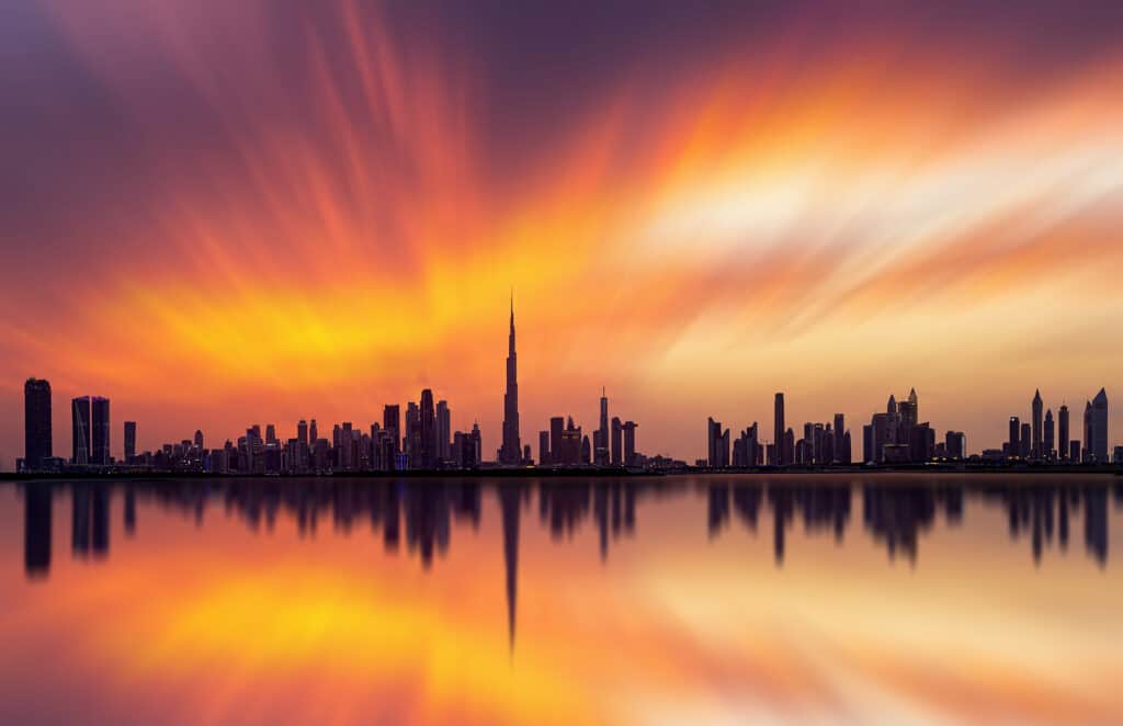 Stunning,View,Of,Dubai,Skyline,With,Warm,Pastel,Sunset,Clouds